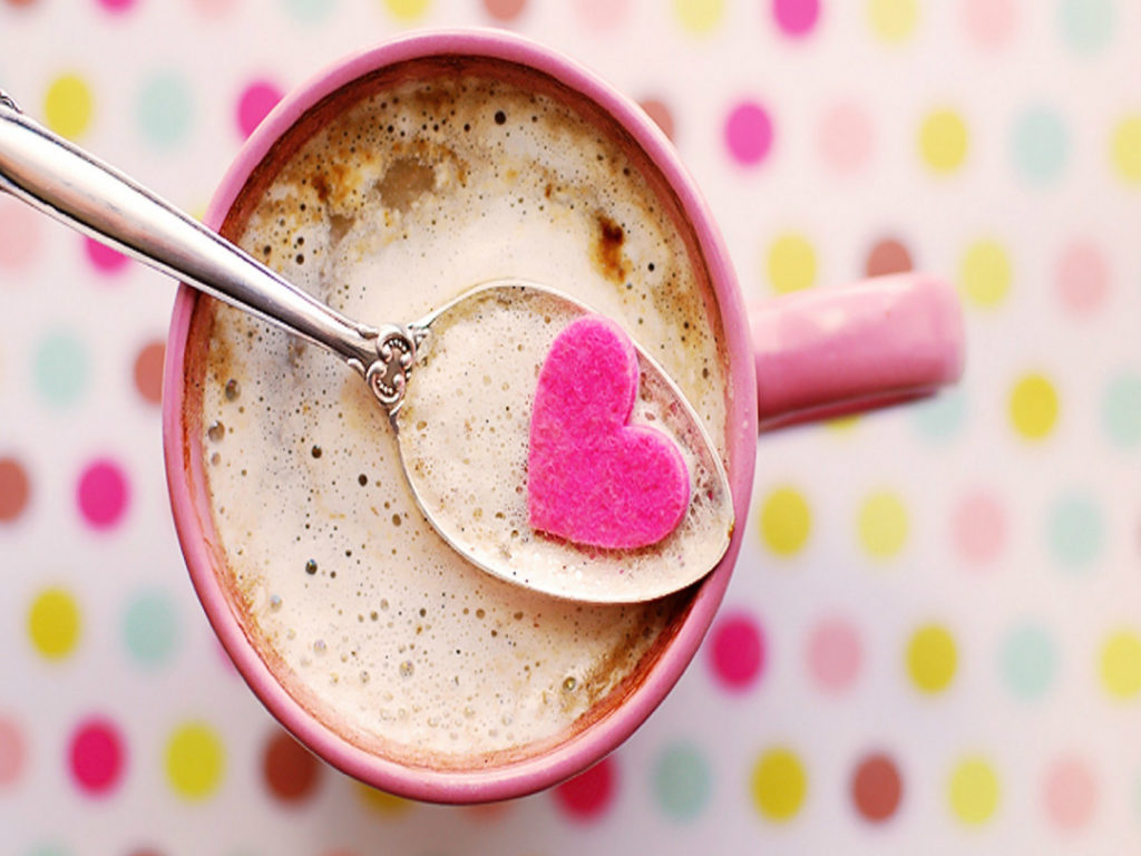 creamy coffee in pink mug